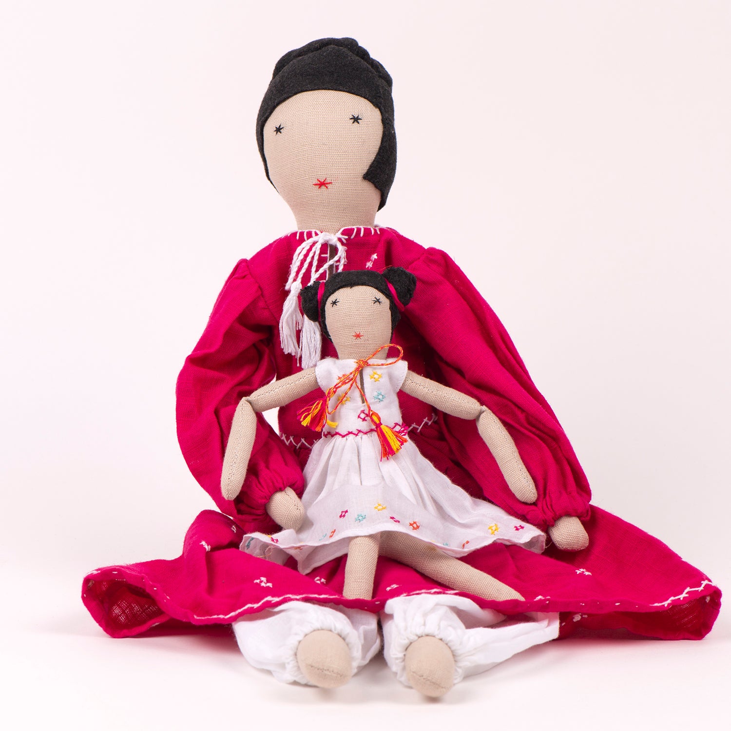 Nargis Mom&Mini dolls showcasing vibrant muslin dresses with intricate embroidery, handcrafted by Afghan artisans.